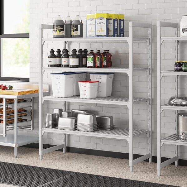 A Cambro Premium Camshelving unit with containers on shelves.