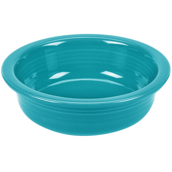 A turquoise Fiesta serving bowl with a white circle on the bottom.