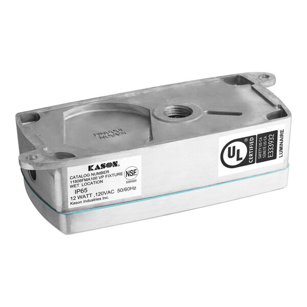 A rectangular Kason 11808FMA100 LED fixture with a metal housing, labeled for 120V, 12W, and 4000K color temperature.