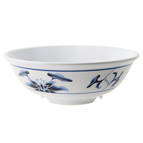 A white bowl with blue and white water lily design.