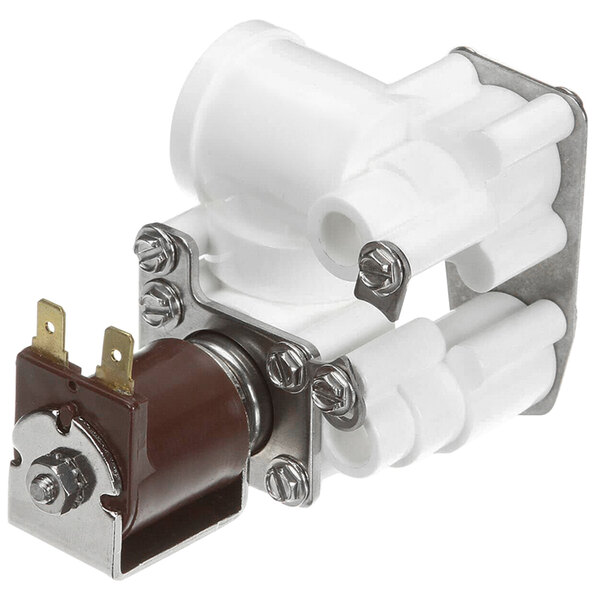 A white plastic Cornelius block valve assembly with metal parts and a brown switch.