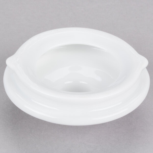 A white porcelain teapot with a lid on a white background.