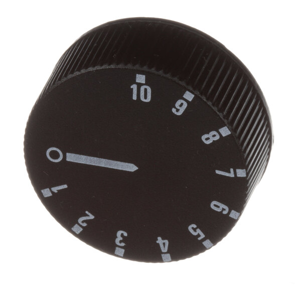 A close-up of a Groen black knob with white numbers.