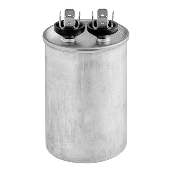 A silver Manitowoc Ice run capacitor with black rubber caps.