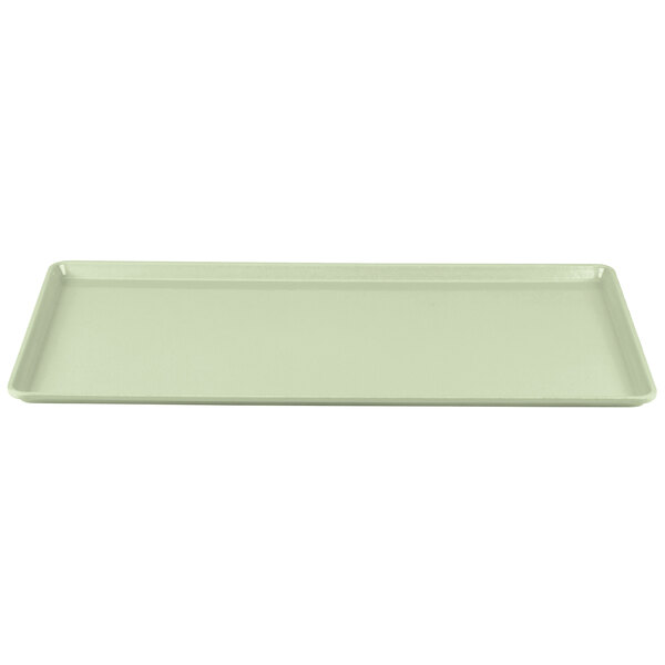 A rectangular white tray with a green border.