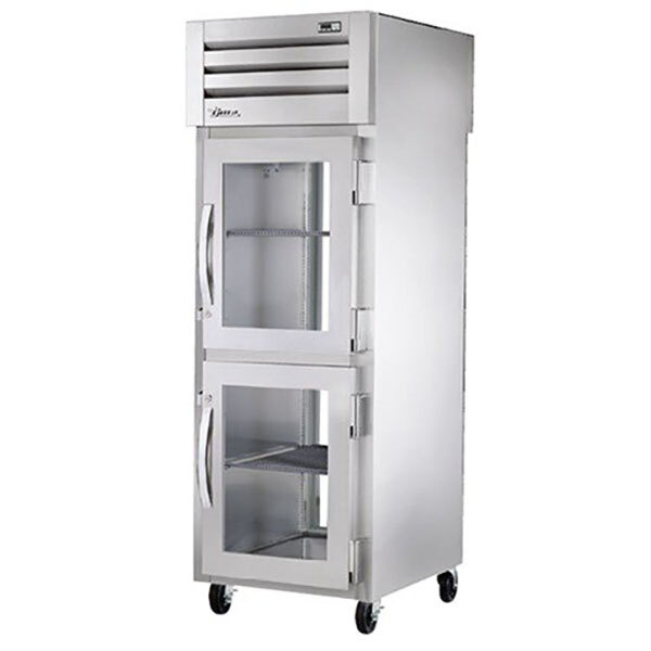 A silver True Spec Series reach-in refrigerator with glass doors and PVC-coated shelves.