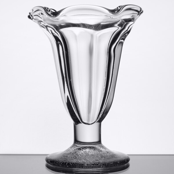 A clear Libbey tulip sundae glass with a curved bottom.