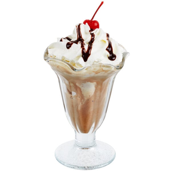 A Libbey tulip sundae glass filled with chocolate ice cream and whipped cream.
