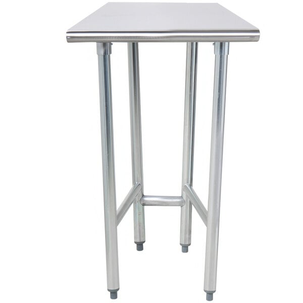 A stainless steel Advance Tabco work table with an open base.