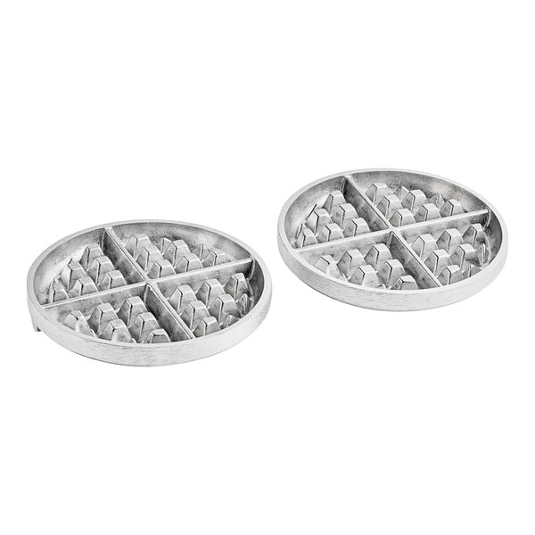 Two silver round metal plates with a grid on them.