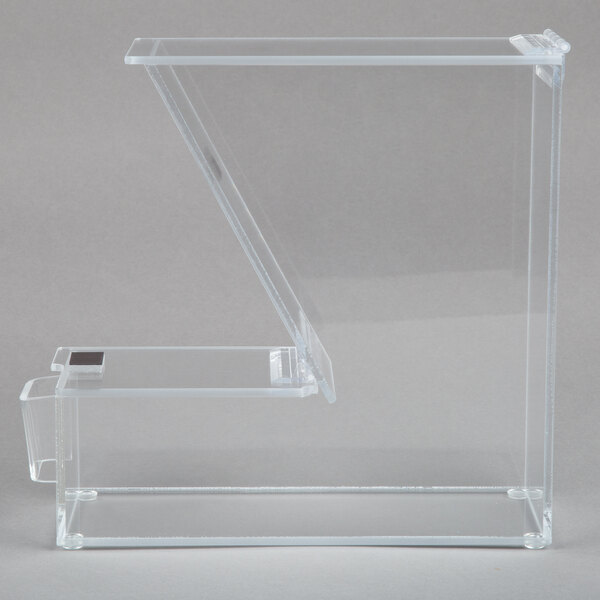 A clear rectangular plastic topping dispenser with a white border.