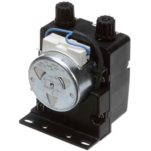 A small black device with a round metal disc and a round metal cylinder with blue and white wires.