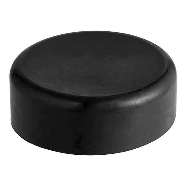 A black circular plastic cap.