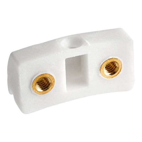 A white plastic Hobart shoe adjustment connector with gold screws.