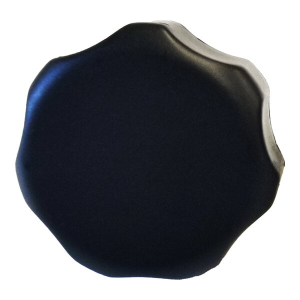 A black food chute release knob with a slightly scalloped edge.