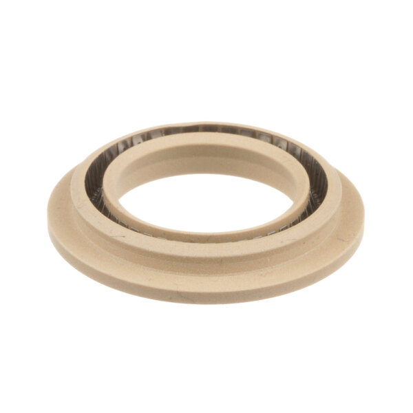 A beige rubber motor shaft seal.