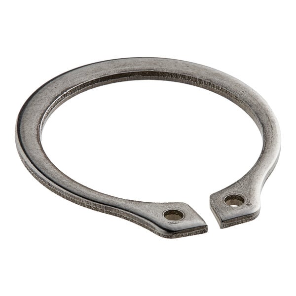 A close-up of a stainless steel Hobart retaining ring with a hole in it.