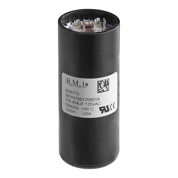 A black cylindrical Manitowoc Ice start capacitor with a white label.