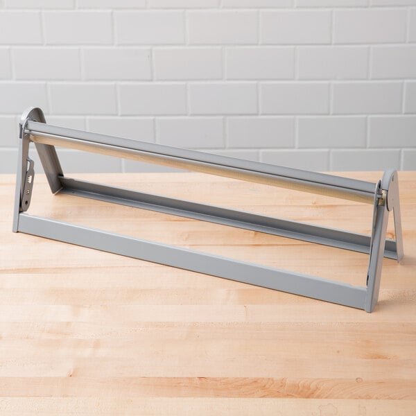 A Bulman metal paper cutter on a table.