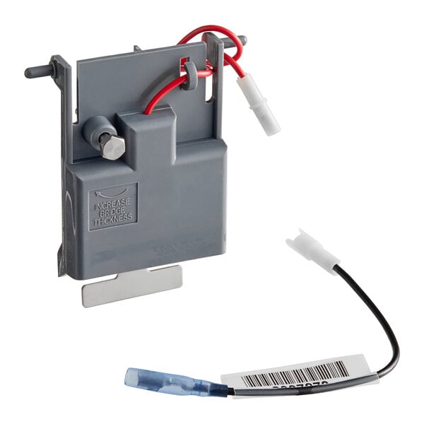 A grey box with red wires.