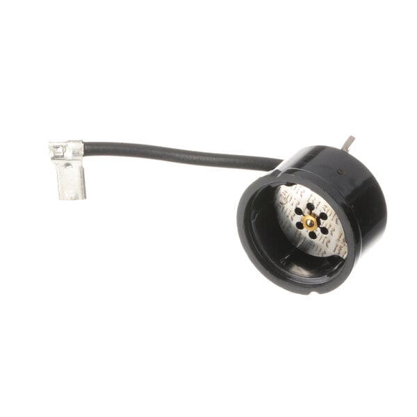 A black round electrical connector for True Refrigeration.