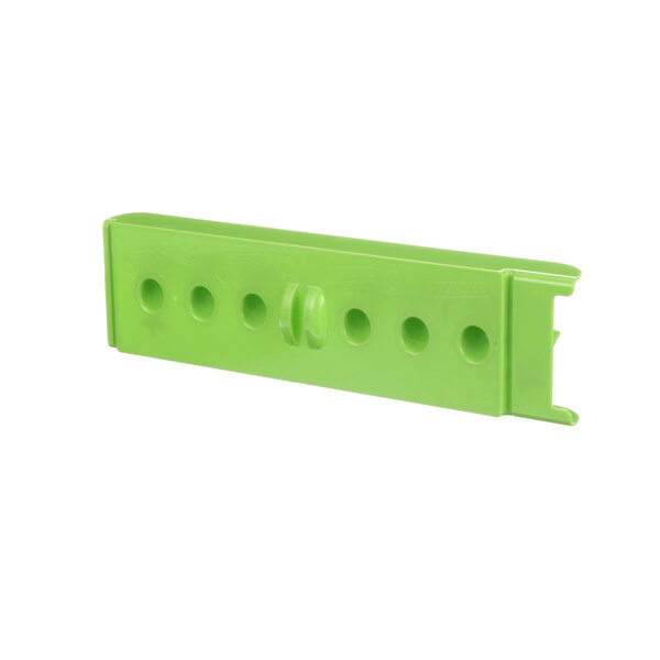 A green plastic Power Soak channel holder with holes on the side.