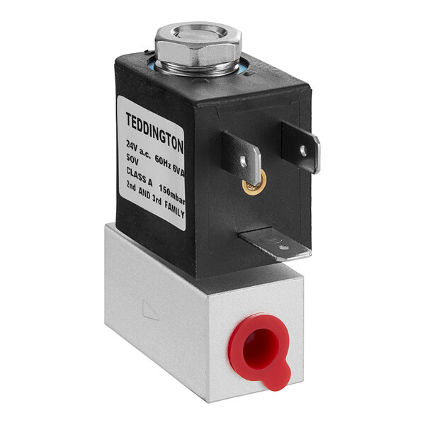 A small black and silver Pitco solenoid valve.