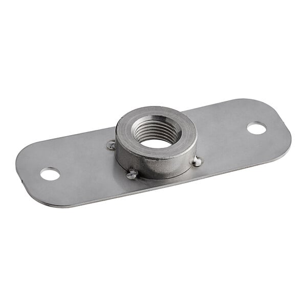 A stainless steel metal plate with a nut on it.