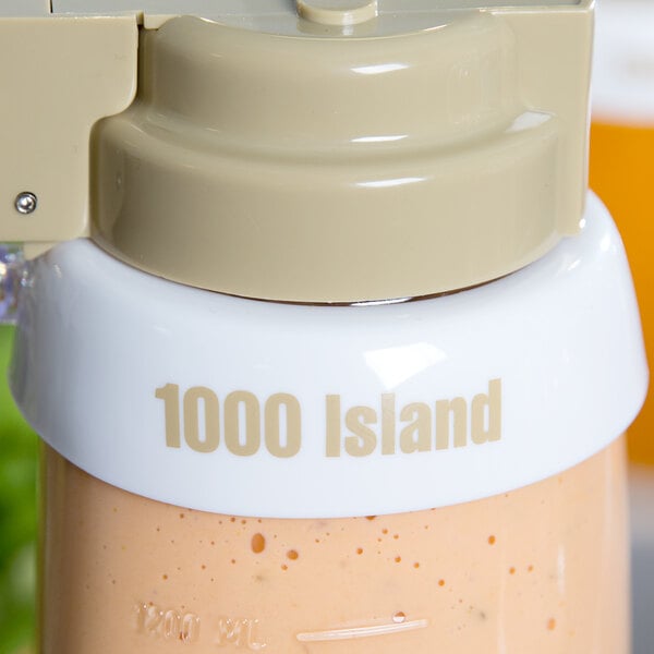 A Tablecraft white plastic salad dressing dispenser collar with beige lettering.