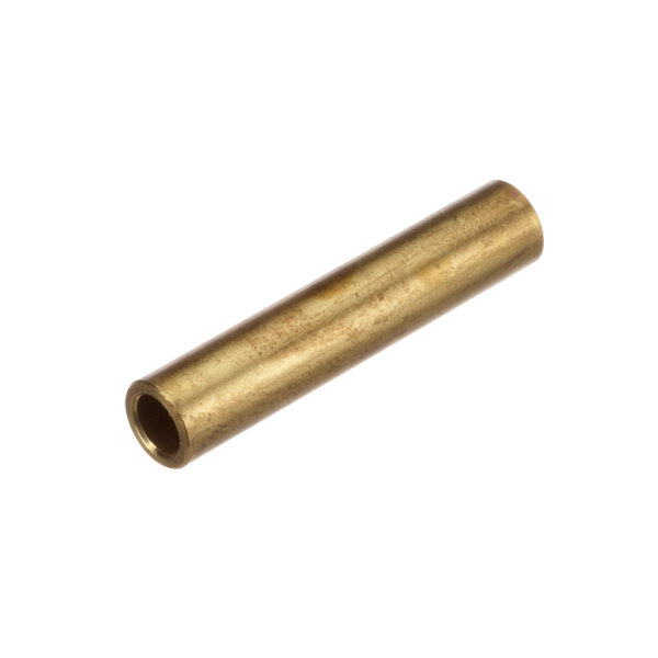 A close-up of a brass tube with a small hole.