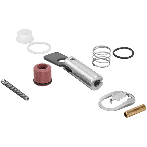 A close-up of a Henny Penny solenoid repair kit with a metal tool and spring.