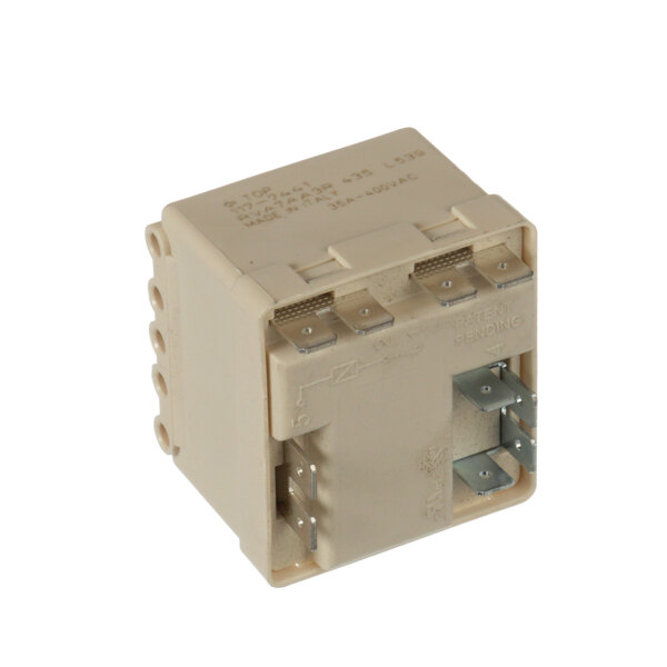 A close-up of a Franke white square electronic switch with metal parts.