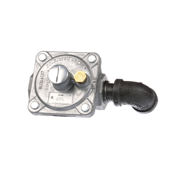 A close-up of a Blodgett gas regulator valve with a black hose.