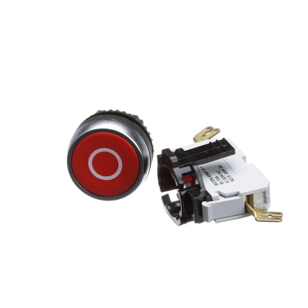 A close-up of a red and black Robot Coupe stop switch button.