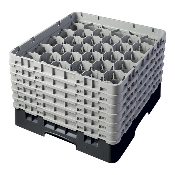 A black plastic Cambro glass rack with 30 compartments and 6 extenders.
