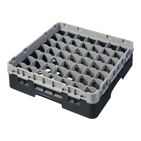 A black and grey plastic Cambro glass rack with many compartments.