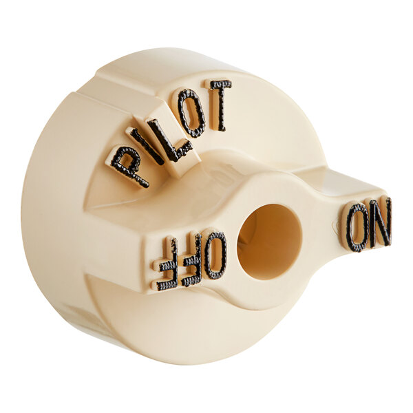 A white Pitco knob with the word "Pilot" on it.