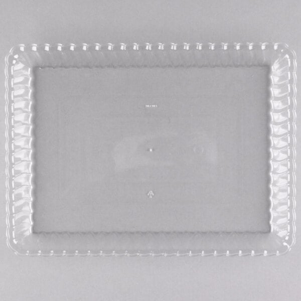 A close-up of a clear plastic Fineline rectangular tray.