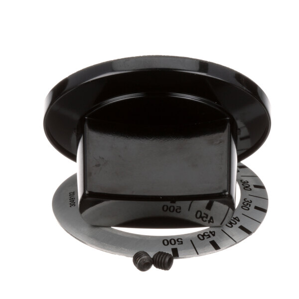A black US Range knob with a circular piece around it.