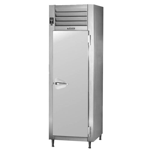 A Traulsen pass-through refrigerator with a white door and a handle.