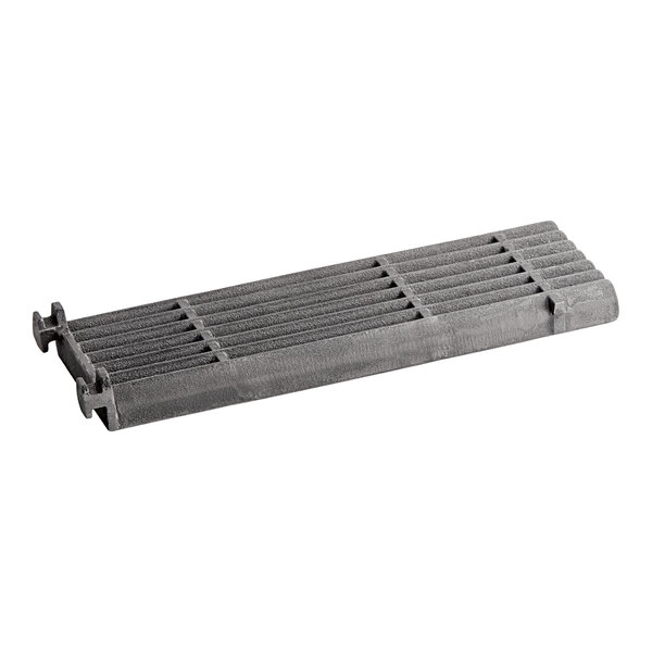 A grey metal Garland broiler grate with holes.