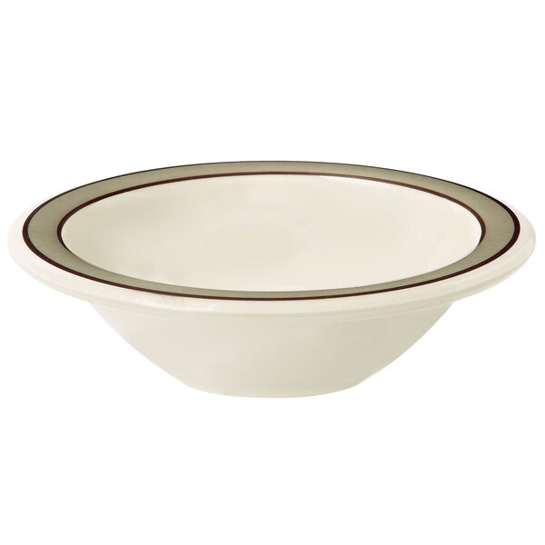 a white bowl with a brown band