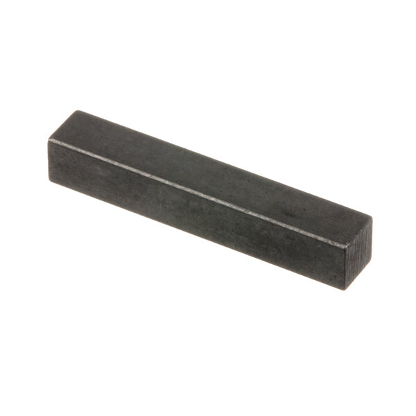 A rectangular black Hobart key.