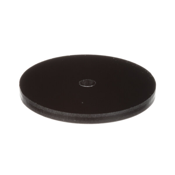 A black disc with a hole in it.
