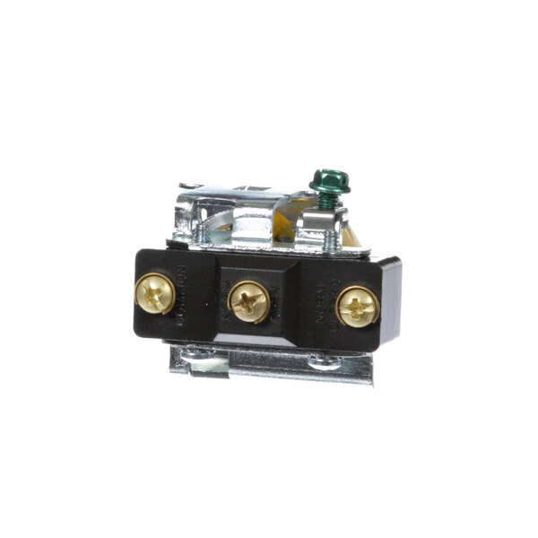 A close-up of a black and gold Groen pressure switch.