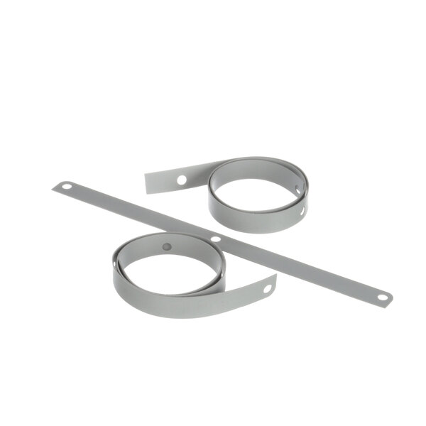 A close-up of several white rubber bands with metal strips.