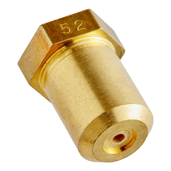 A gold metal Vulcan over burner orifice with a hole.