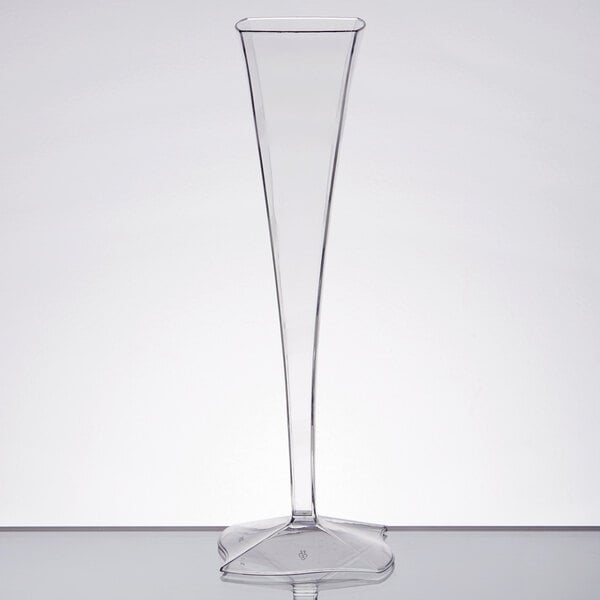 A clear Fineline Wavetrends champagne flute on a white surface.