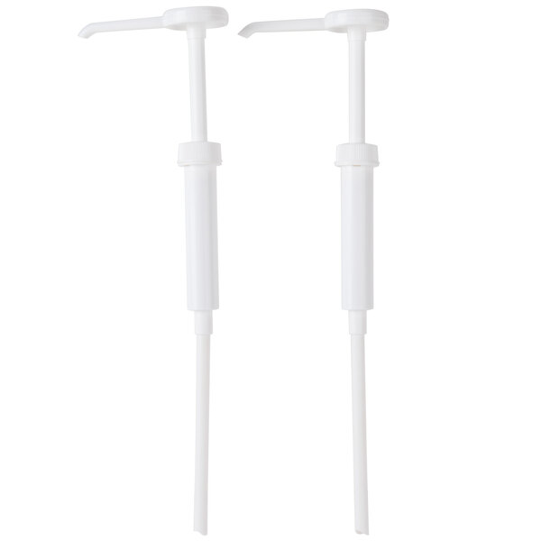 Two white plastic San Jamar condiment dispenser pumps.