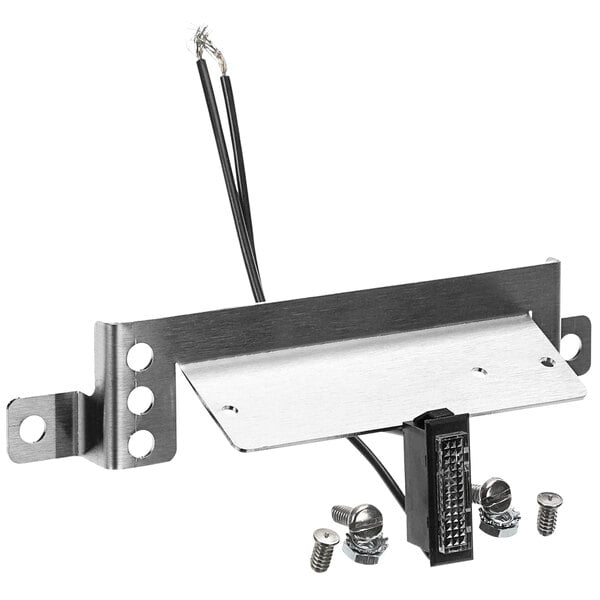 A metal Cleveland steam equipment plate with wires and screws.